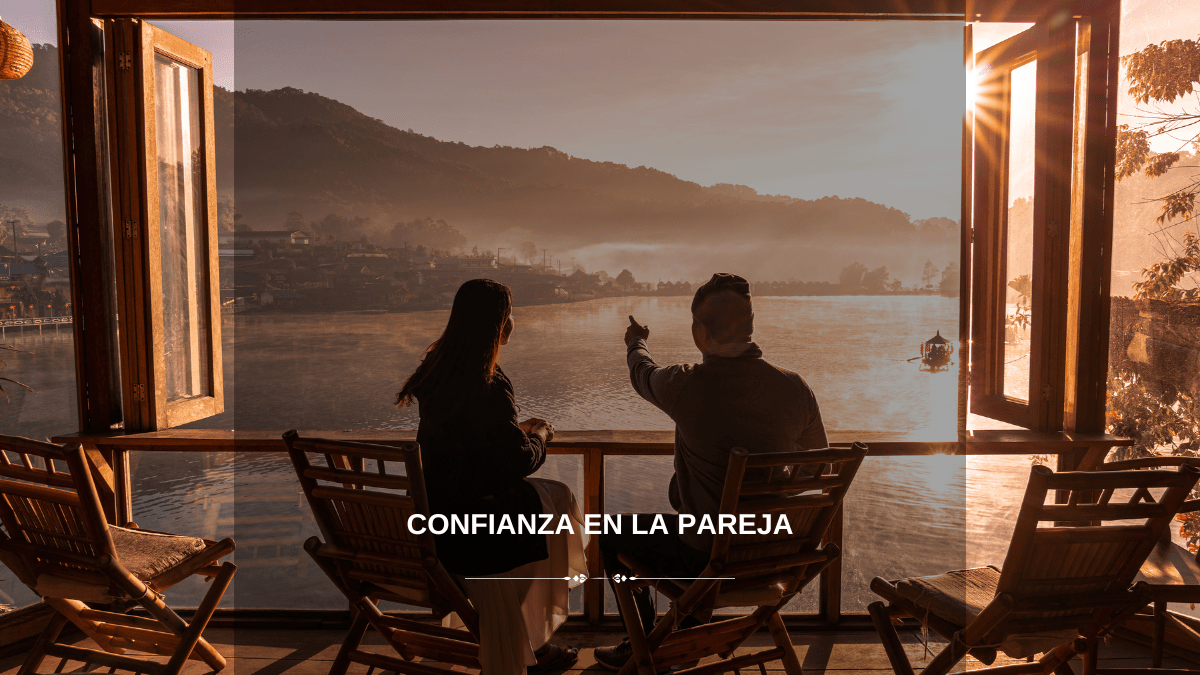 Pareja sentada frente a un lago al atardecer, compartiendo un momento íntimo y tranquilo, simbolizando la confianza y la conexión en la relación.